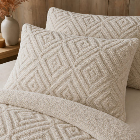 Close-up of natural Romo fleece pillowcases showing the raised geometric sherpa texture