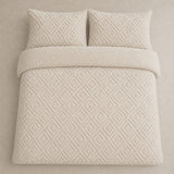Overhead flat lay of the natural Romo fleece duvet cover set with two matching pillowcases