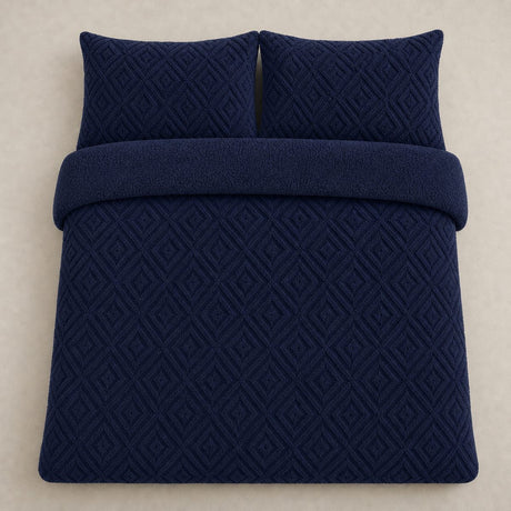 Overhead flat lay of the navy Romo fleece duvet cover set with two matching pillowcases