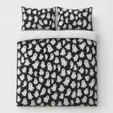 Overhead flat lay of the Spooky Ghosts Halloween Microfibre Duvet Cover Set with two matching pillowcases