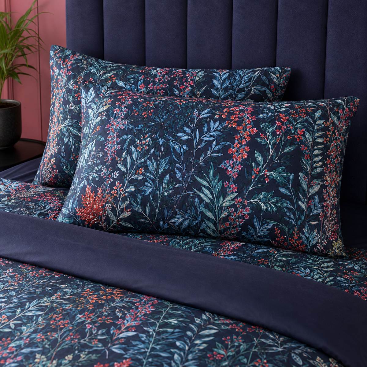 Close-up of matching Tessa Floral Navy 200 Thread Count Cotton Duvet Cover Set pillowcases showing the pattern and fabric detail