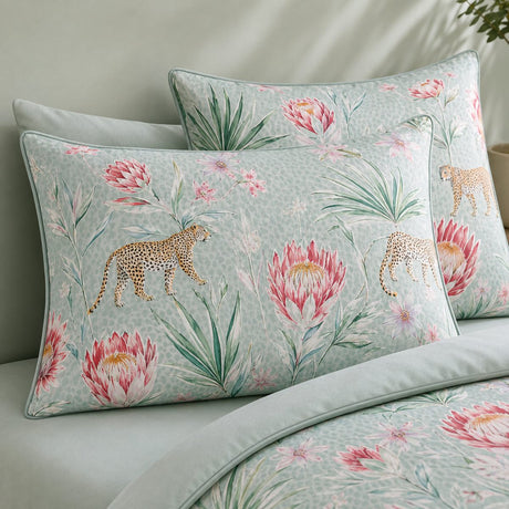 Close-up of Tropical Leopard pillowcases showing protea flowers palm leaves and leopard print