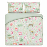 Overhead flat lay of the Tropical Leopard green duvet cover set with two pillows