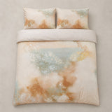 Overhead flat lay of the Tuscany Cotton Duvet Cover Set in natural with two matching pillowcases