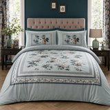 Windsford pale blue cotton sateen floral border duvet cover set styled in an elegant bedroom