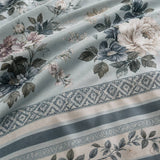 Macro close-up of Windsford cotton sateen fabric with floral print and decorative border