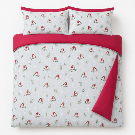 Overhead flat lay of the Winter Robin Duck Egg Microfibre Christmas Duvet Cover Set with two matching pillowcases